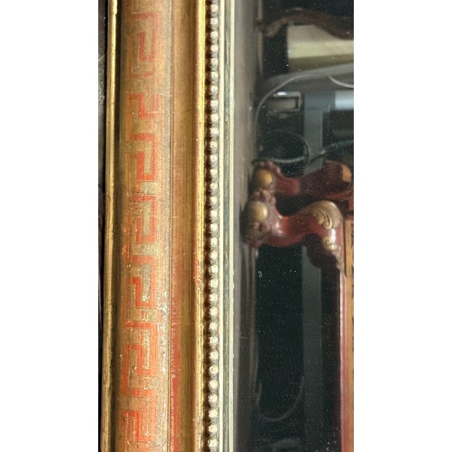 This is a 19th-C. French Louis Philippe giltwood mirror with a Greek key pattern and beaded molding. The water-gilt and...