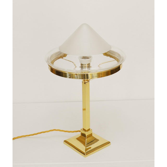 Art Nouveau table lamp Art Nouveau floor lamp, circa 1915. Square base, square column. Clear glass shade, frosted at the...