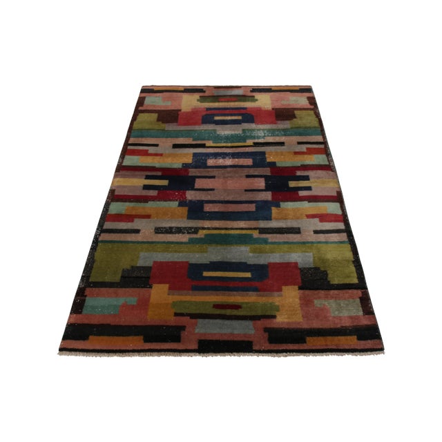 A vintage 4x8 rug connoting a mid-century Deco style, hand knotted in wool originating from Turkey circa 1950-1960. Hand...