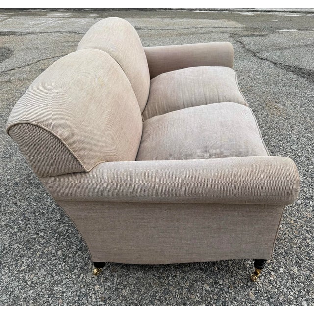 George Smith Full Scroll Arm Sofa in flax linen with down seat cushions on turned legs with brass casters.