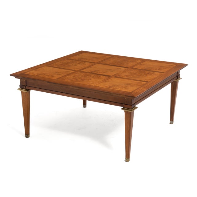 A Mid-Century coffee or end table with nine stunning burl inlays and brass plated accents by Mastercraft. This square...