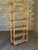 Really nice bamboo, cane, and rattan bookshelf. Nice finish with bamboo frame, rattan wrapped corners, and cane shelves....