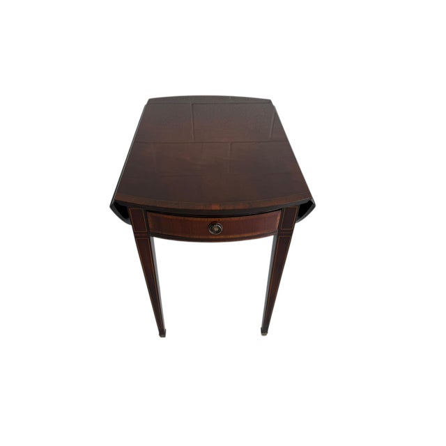 Elegant vintage drop-leaf table featuring classic Federal-inspired lines. Leaves fold down to just 21.5" wide - perfect...
