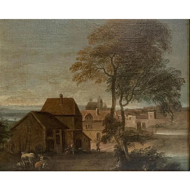 This 18th-century Flemish painting depicts a landscape composed of glimpses of country houses near an ancient fortified...