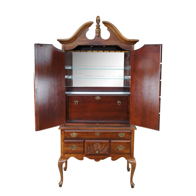 Late 20th Century American Drew Highboy Liquor Cabinet, circa 1980s. Features a cherry frame with an open pediment and two...