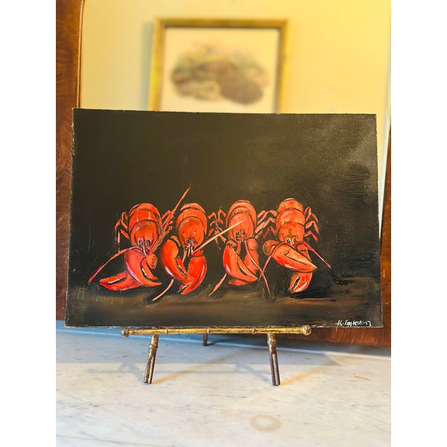 A charming original folk art painting depicting four vibrant red lobsters gathered together against a dramatic black...
