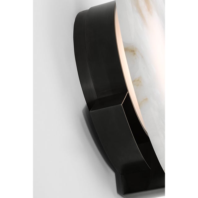 Melange 13" Sconce in Bronze with Alabaster Designer: Kelly Wearstler Finish: Bronze Height: 13" Width: 12.75" Extension:...