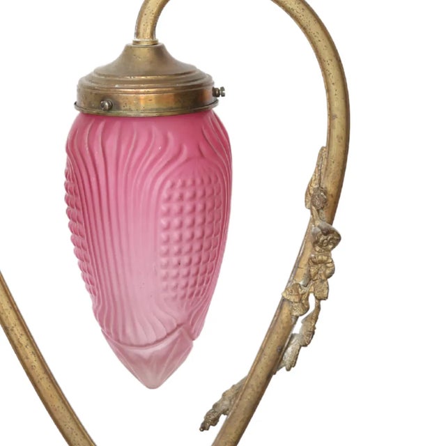 Elevate your space with this charming light pink chandelier from France, circa 1900. Crafted from metal, it exudes...