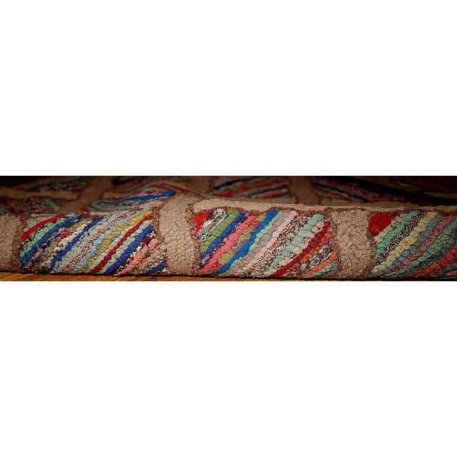 Antique hand hooked American runner in original good condition from the end of 19th century. This rug made in multiply...