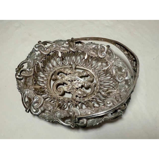 This antique ornate silver plate repousse style candy dish is a handmade piece with intricate detailing and a unique...