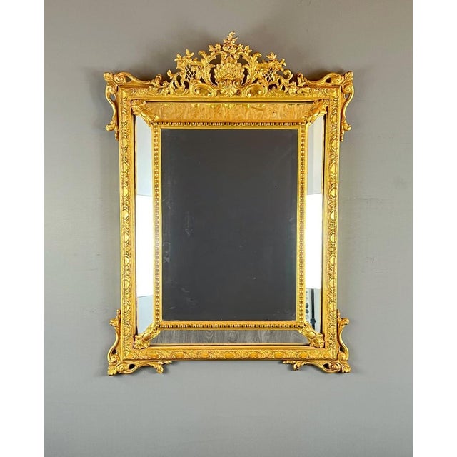 Large Giltwood Mirror, 19th Century Superb mirror with a richly carved giltwood pediment, adorned with rocaille motifs,...