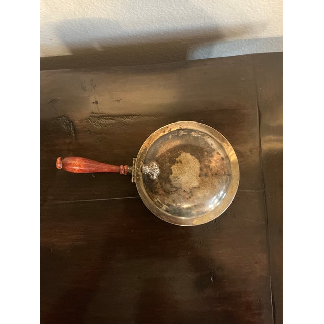 Elegant vintage covered serving dish or warming server featuring a silver-plated finish, domed lid, and beautifully turned...