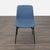 The Cato chair is channel tufted in Medley Ink upholstery on steel legs. The architectural shape of the base and the...