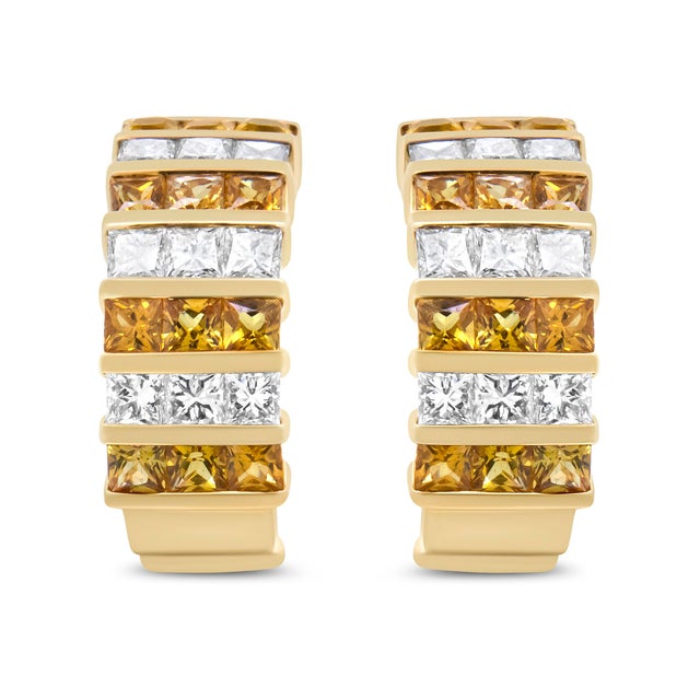 The modern design of these 18k yellow gold huggie hoop earrings will complete your outfits in a signature style. Rows of...