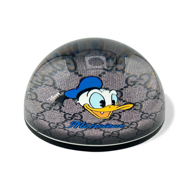 Rare find from Gucci X Disney! Features the classic Gucci logo in the background. Blue leather backing with Gucci logo-...