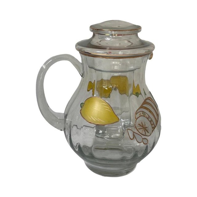 Decanter or pitcher made by Paul Nagel. Best part is the glass inlay that can be filled with ice so you can chill your...