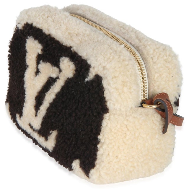 Designed to be compact yet large enough to hold the essentials, the Louis Vuitton cosmetic pouch matches the House's bags...