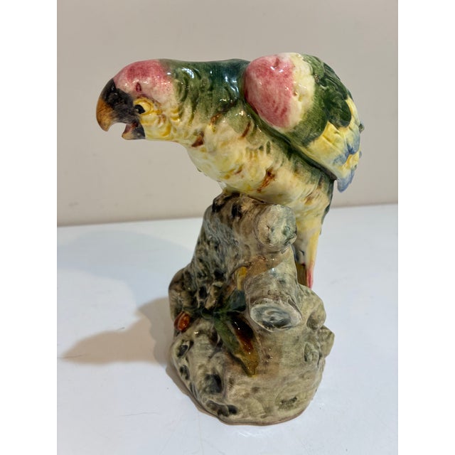 Charming vintage Italian majolica parrot, beautifully modeled as a colorful tropical bird perched upon a naturalistic tree...