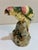 Charming vintage Italian majolica parrot, beautifully modeled as a colorful tropical bird perched upon a naturalistic tree...