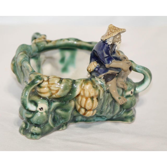 This unique piece from China likely dates between 1900 and 1920, has an excellent exterior glaze and amazing detail, right...