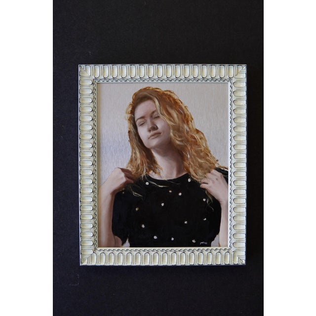 This oil painting on aluminum panel captures a serene moment, featuring a figure with closed eyes and flowing hair,...