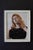 This oil painting on aluminum panel captures a serene moment, featuring a figure with closed eyes and flowing hair,...