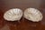 This beautiful pair of small bowls are sterling silver and marked on the back. They are in the shape of of scalloped...