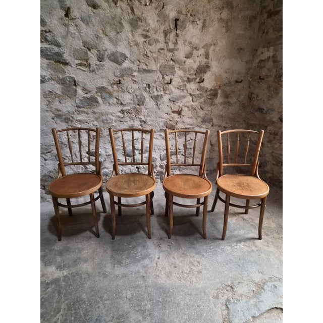 Set of four Fischel bentwood bistro chairs, made in Czechoslovakia and dating from circa 1930–1950. The chairs are made...