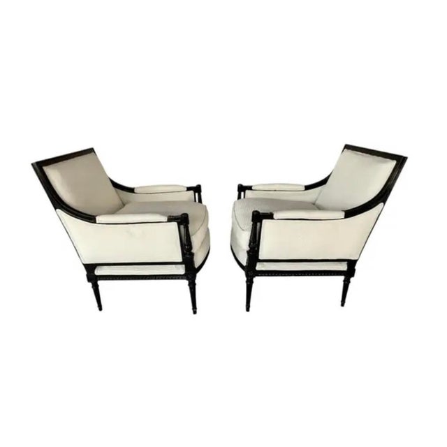 Elegant pair of vintage Mid=Century French Louis XVI–style Bergère à la Reine Salon Armchairs, upholstered in a...
