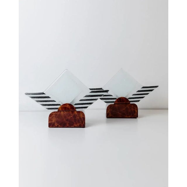 This rare pair of vintage Murano glass table lamps from the 1980s showcases an eye-catching sculptural design. Set into...