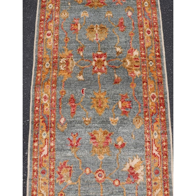 Early 21st Century Turkish Angora Oushak Runner With Denim Blue Field and Rust Motifs For Sale - Image 5 of 13