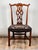 A mid 19th century Chippendale style side chair with a classic silhouette and nicely executed pierced splat back,...