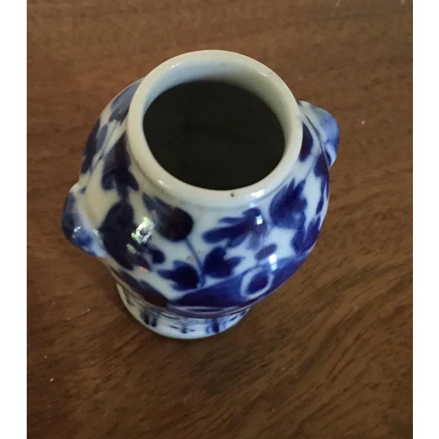 Antique 19th c. Chinese blue & white porcelain vase of small size with lion mask handles to each side. Decorated with an...