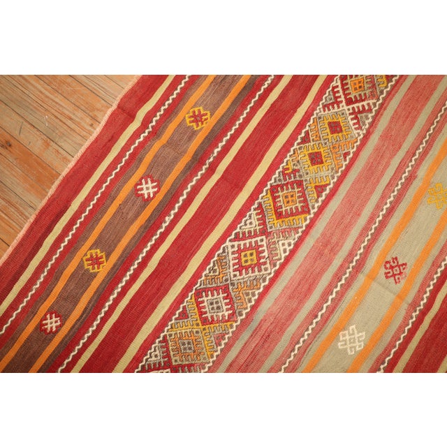 Pair of mid-20th century Turkish Kilims. Measuring 66" x 70" and 70" x 78" respectively.
