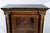 A Napoleon III-style Boulle display cabinet in ebonized wood and gilded bronze dating from the second half of the 19th...
