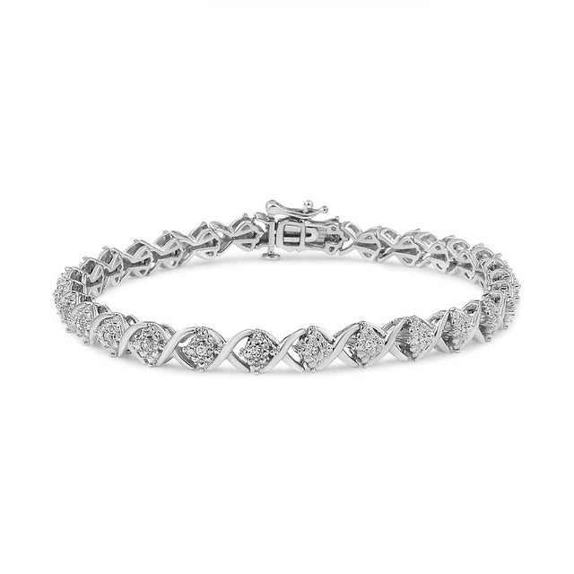 With a total diamond weight of 1/4 cttw, this silver bracelet is sure to shine on your wrist and elevate any outfit of...