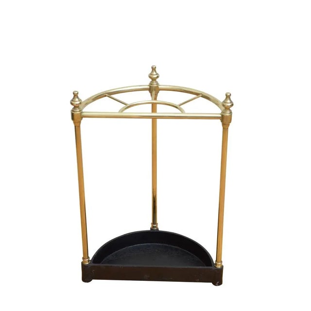 P0230 english half moon umbrella stand in brass, having five divisions with decorative finials and black drip tray with...