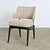 English vintage mid-century modern armchair in the manner of Kofod-Larsen with a detached seat back on springy metal bars...