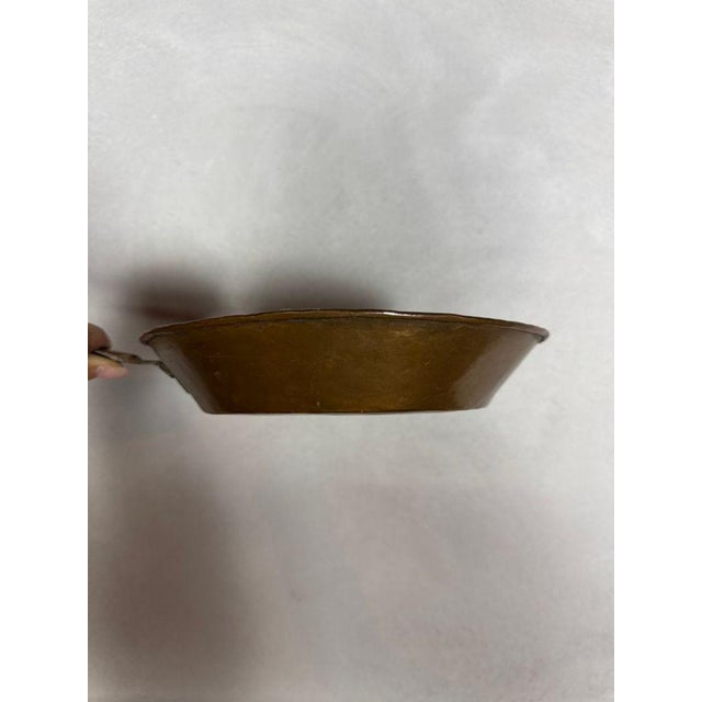 Vintage hammered copper fry pan featuring a warm, aged patina and beautifully textured surface. Crafted with classic...