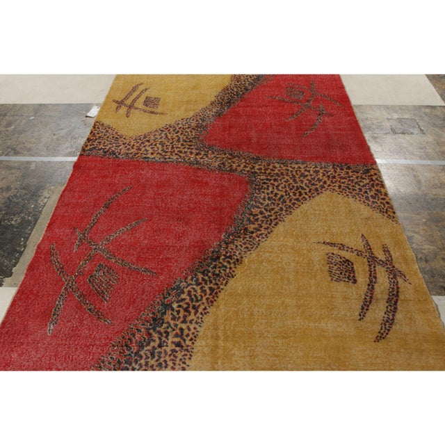 Hand-knotted in wool, a 6x10 vintage Art Deco rug making a grand entry to Rug & Kilim’s commemorative Mid-Century Pasha...