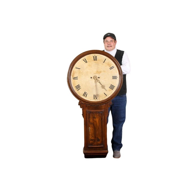 This 19th Century George III walnut tavern clock is a superb example of oversized English wall clocks that are rare and...