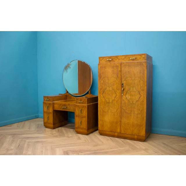 An impressive quality Art Deco burr walnut compactum, circa 1930s There's drawer to the top and in the cupboard is a pull...