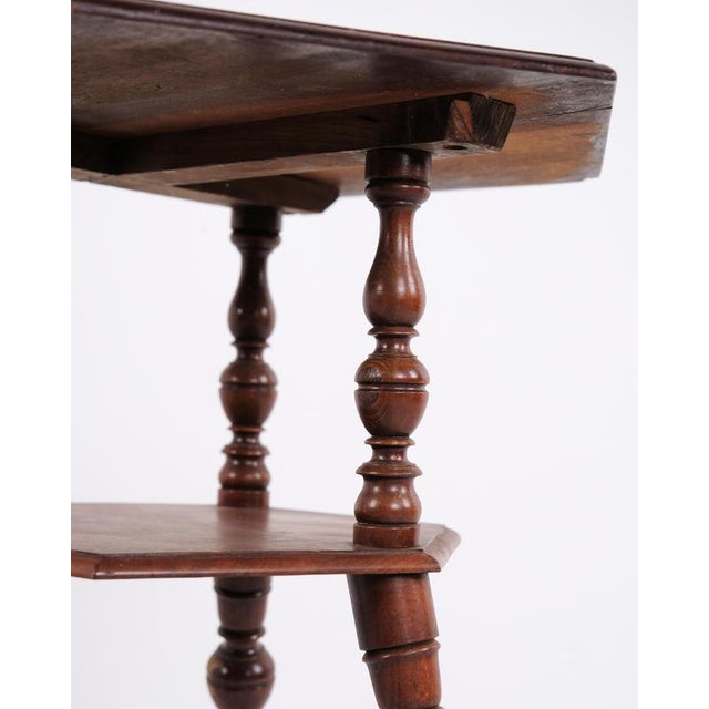 Mahogany side table with a lower shelf and turned round legs, dating from the 1920s. Suitable as a side table, plant...