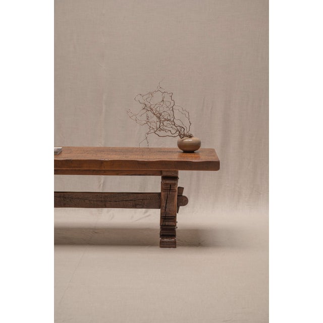 An impressive large-scale Brutalist dining table from the 1970s, entirely crafted from solid oak and distinguished by its...