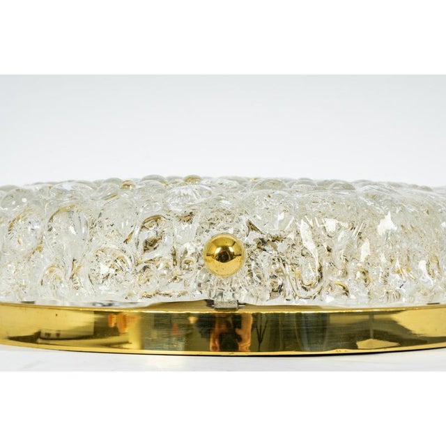 A wonderful round murano glass flush mount by hillebrand leuchten, germany, 1970s. Thick textured bubble glass fixed on a...