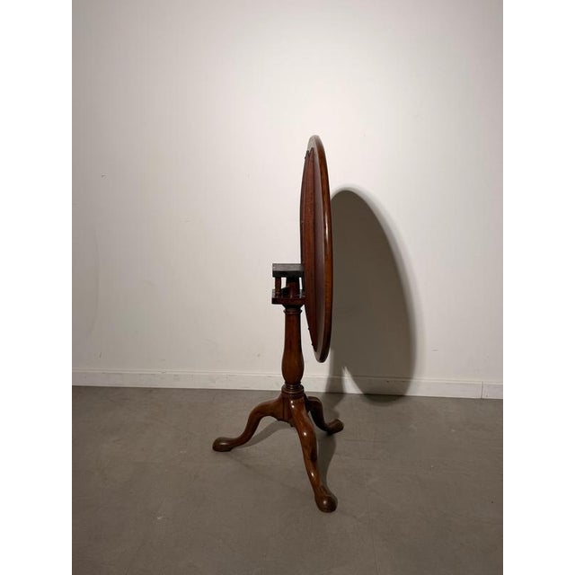 The tabletop incorporates a traditional turn-and-flip mechanism , allowing the top to rotate and tilt into a vertical...