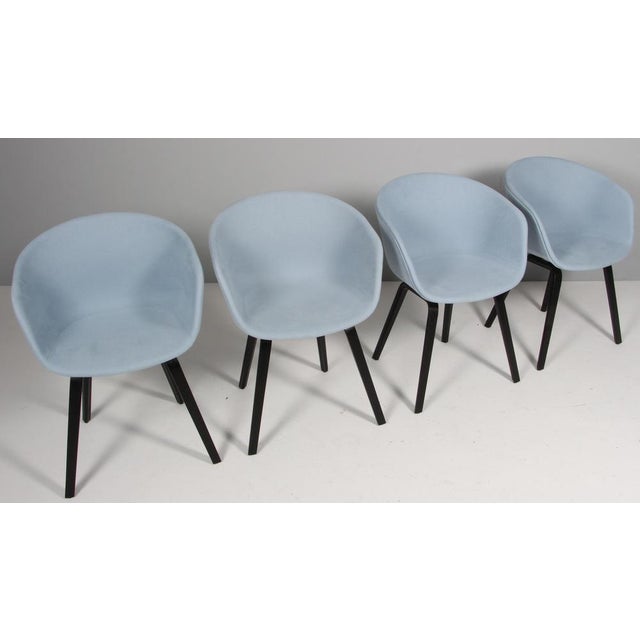 Hay AAC22 dining chairs in fabric with black stained oak legs. This piece is attributed to the mentioned designer/maker....