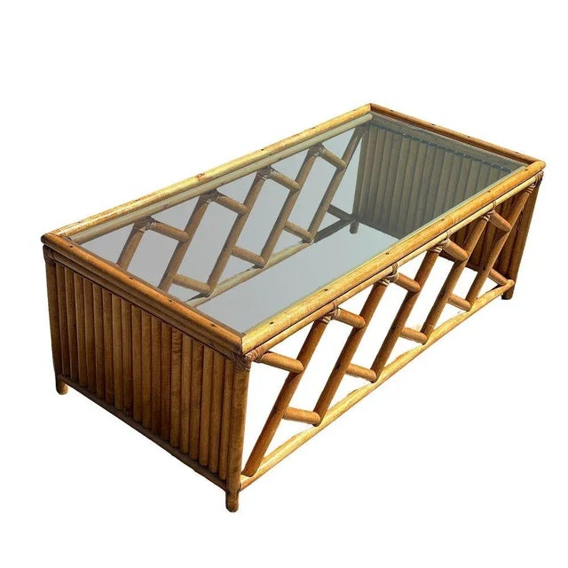 Original Heywood Wakefield living room set featuring a pair of "Oak Rattan" lounge chairs with a matching glass top coffee...