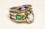 A beautiful cluster ring of faceted gemstones--an oval aquamarine, a marquise cut amethyst and a pear-shaped green...