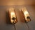 Pair of Swedish vintage wall lamps / sconces approx. 1960s. Elegant mid-century modern design with crystal glass and shiny...